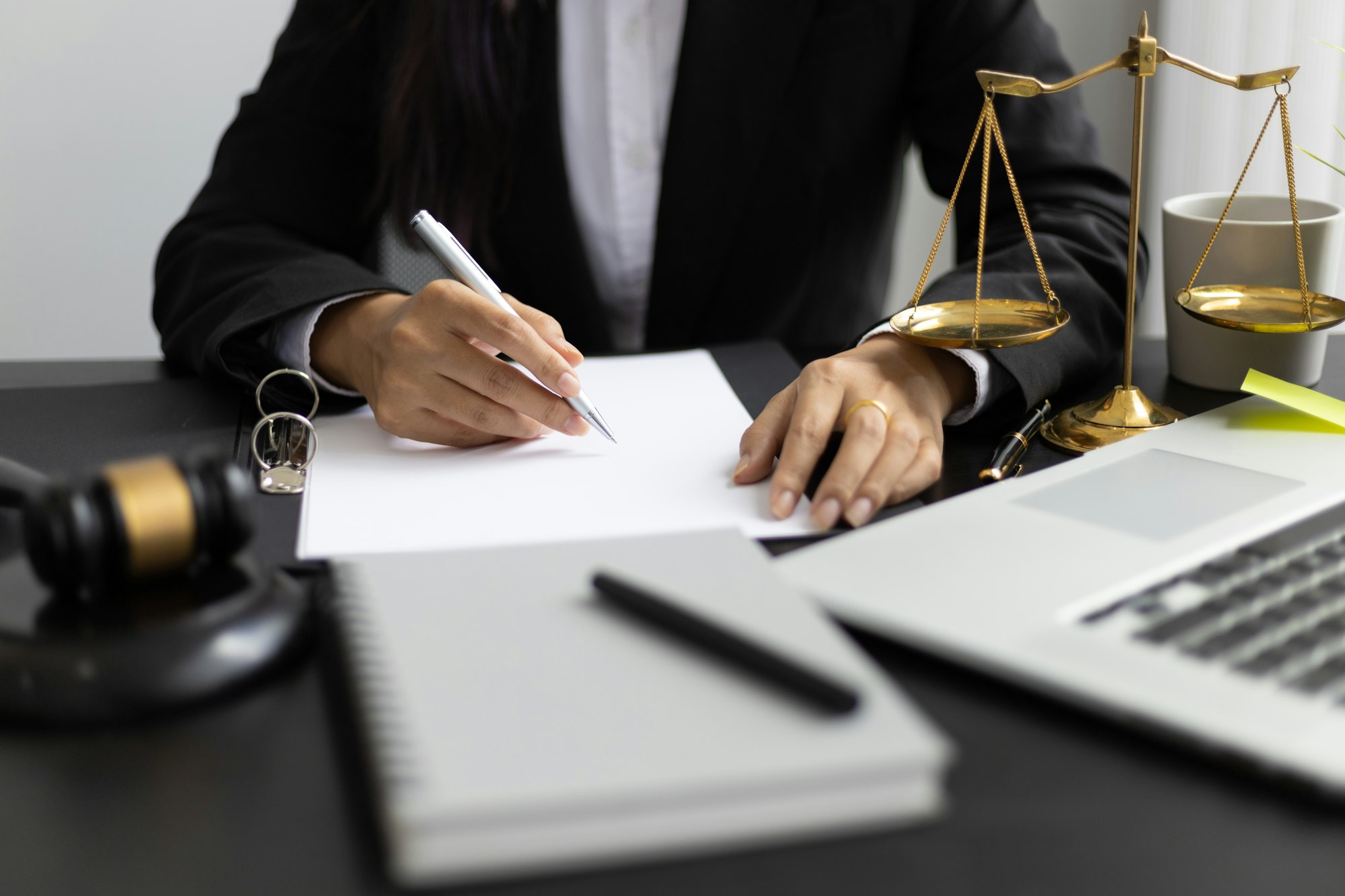 Attorney working on a desk in a law firm.